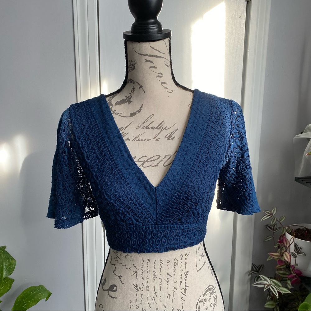 Blue, lace, boho crop top with cute bow tie in the back.
